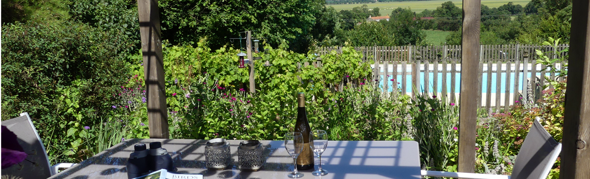 Relax on the terrace at L'Ecurie Holiday Cottage